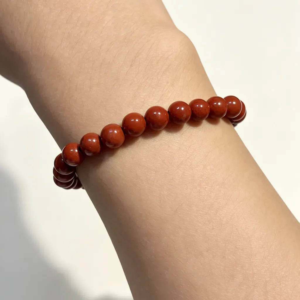 South Red Agate Bracelet worn on the wrist — 8mm red agate beads