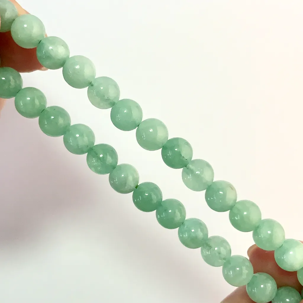 Burmese Jade Bracelet detail — natural mineral veins and polished jade surface