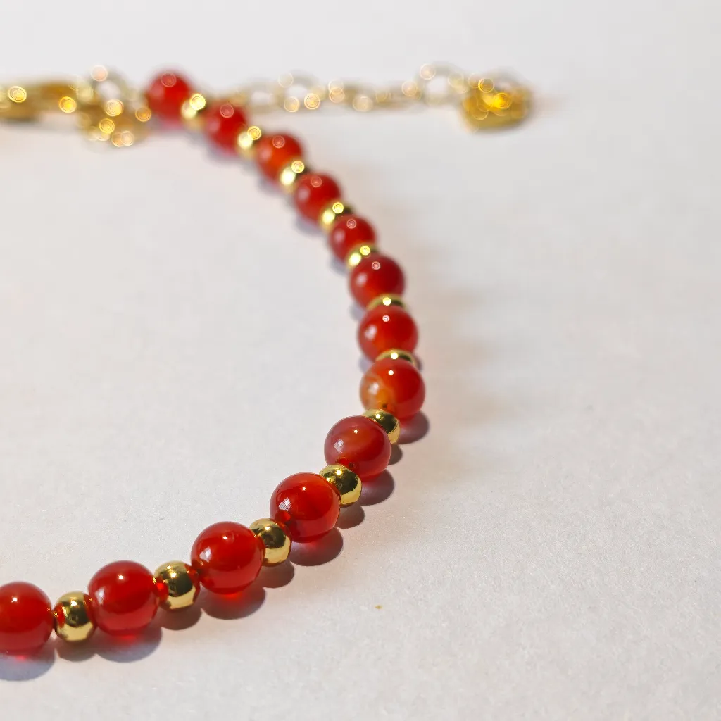 Close-up of carnelian bracelet beads and stringing
