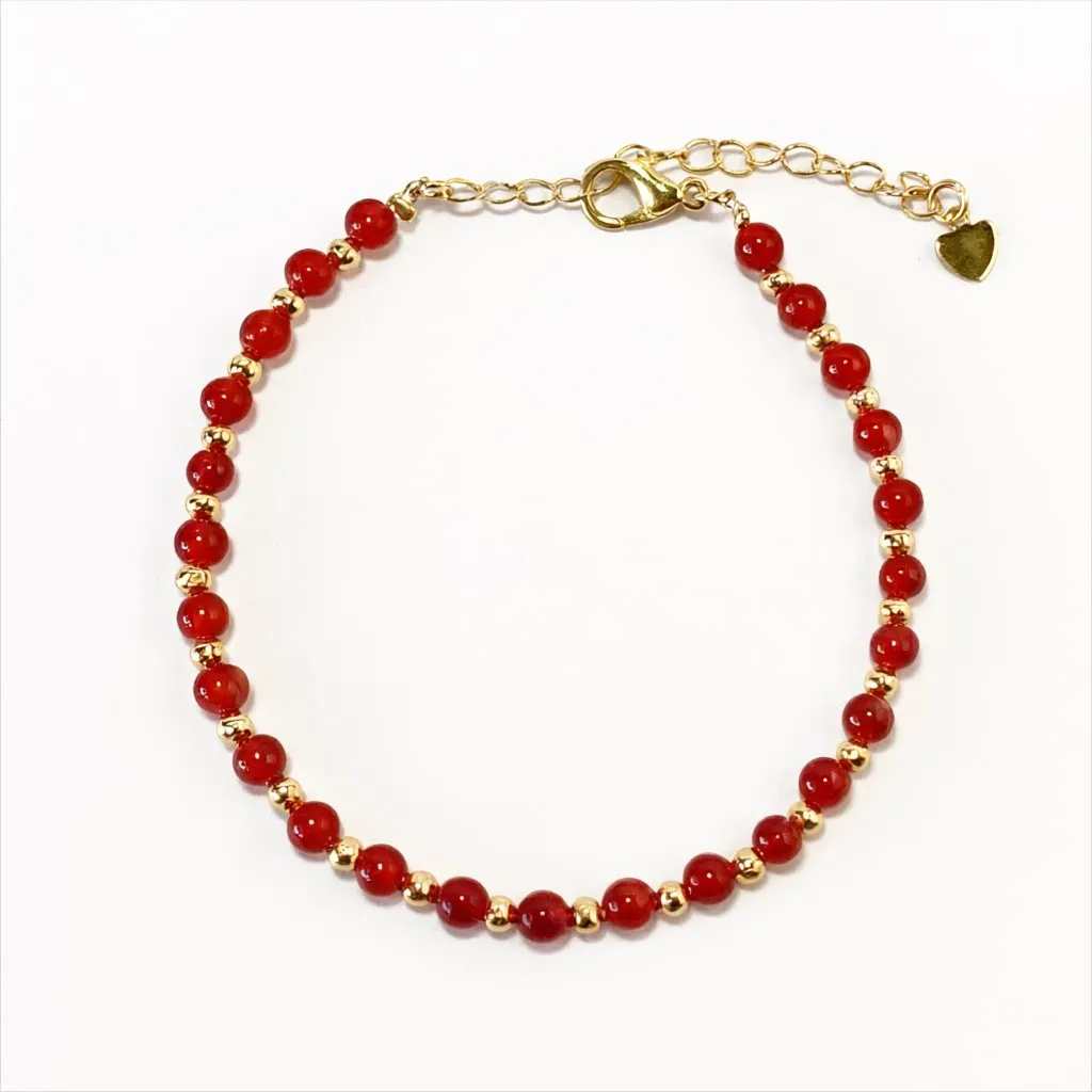 Carnelian bracelet — front view, warm orange carnelian beads on white background